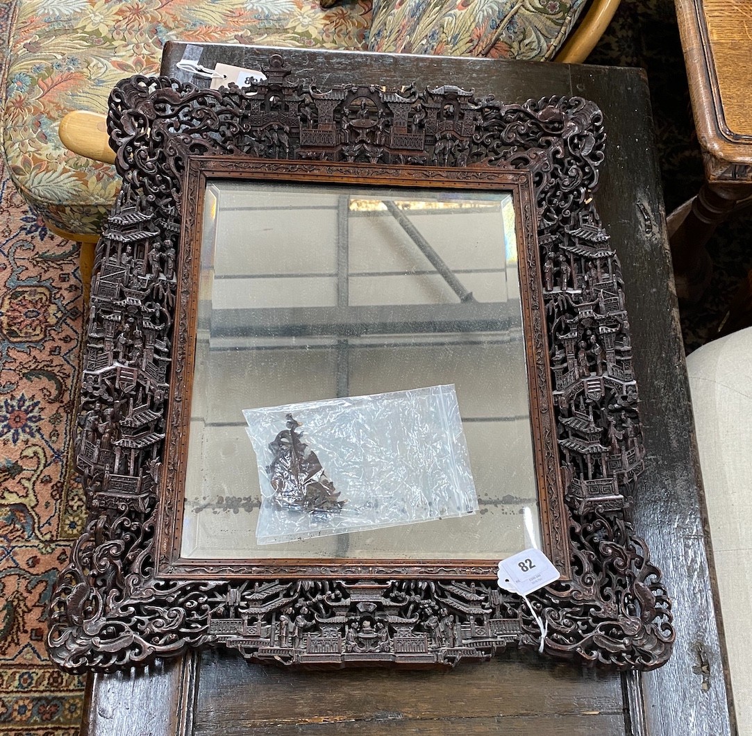 A Chinese rectangular carved hardwood wall mirror, width 52cm, height 64cm